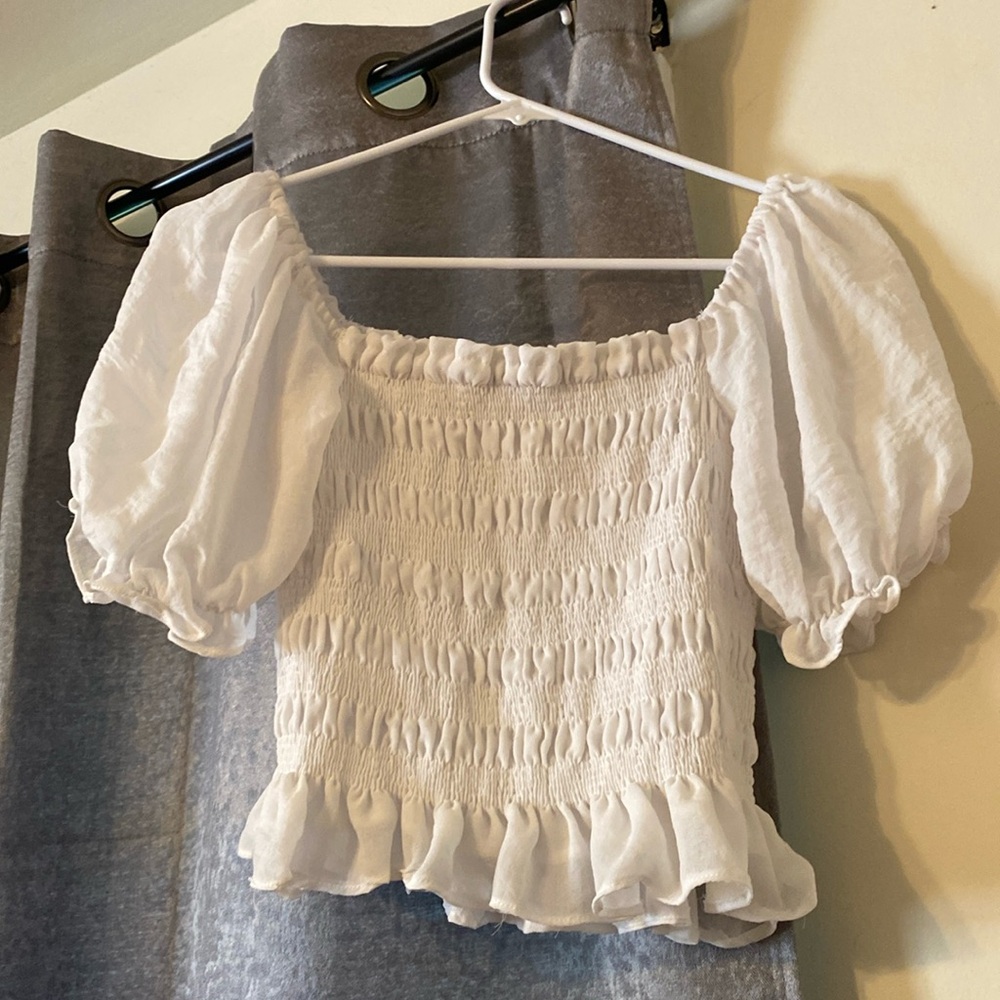 White Cropped top with half sleeves.